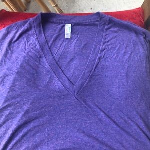 Three tee shirts, blue, purple and black